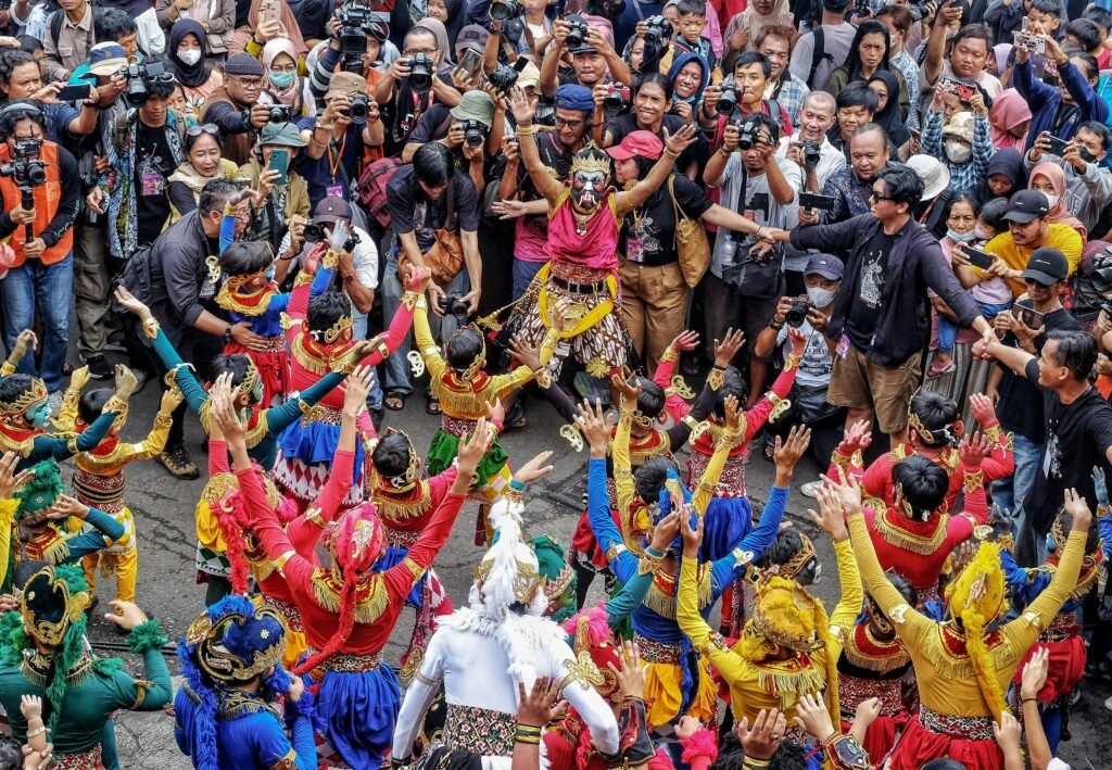 Vibrant traditional dance performance captivating a crowd in Surakarta, Central Java, Indonesia.