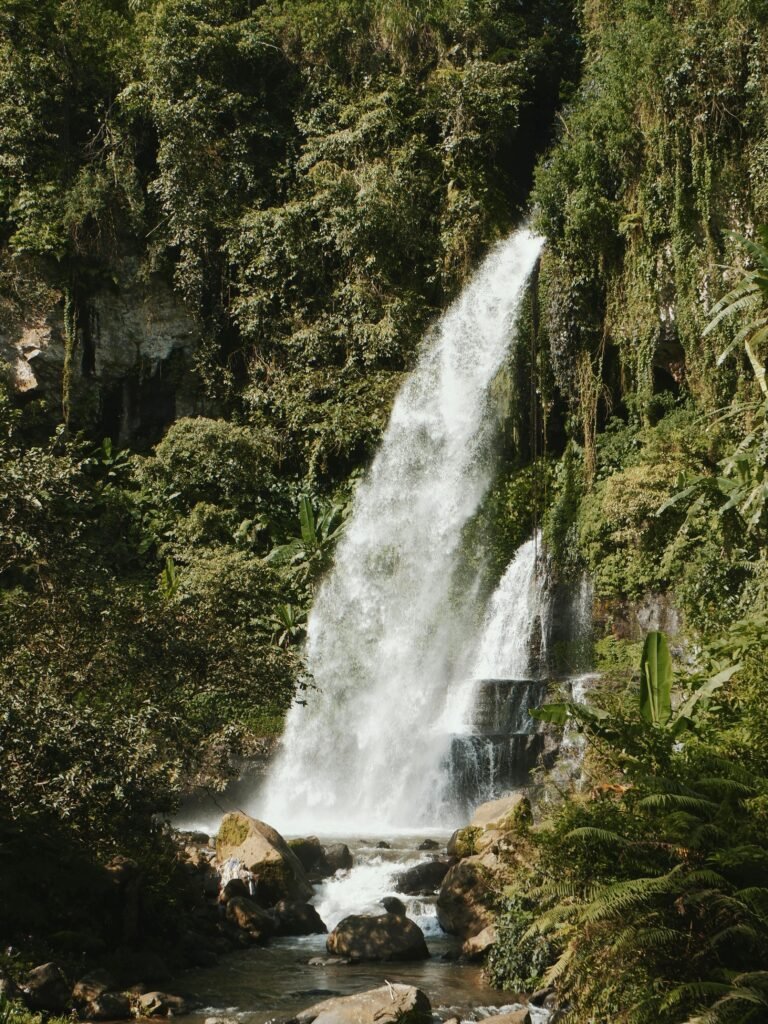 Discover a stunning waterfall in the verdant forests of Jawa Barat, Indonesia.